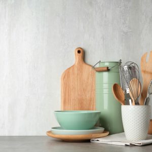 Different,Kitchen,Utensils,On,Grey,Table,Against,Light,Background.,Space