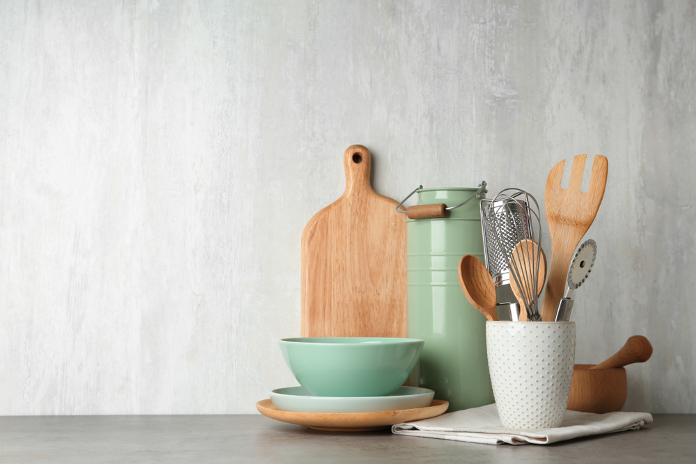 Different,Kitchen,Utensils,On,Grey,Table,Against,Light,Background.,Space
